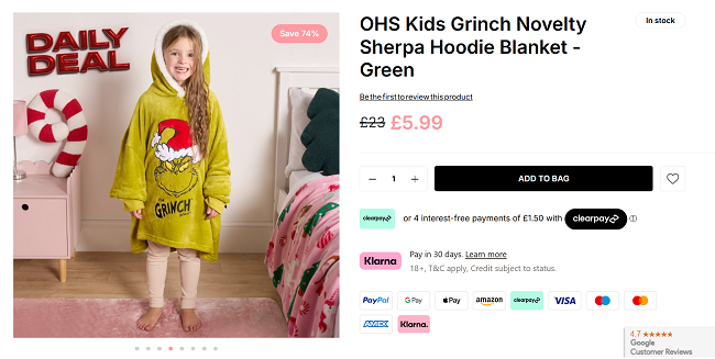 Screenshot showing Kids Grinch Novelty Sherpa Hoodie Blanket for £5.99 at Online Home Shop