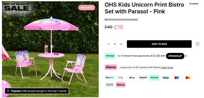 Screenshot showing Kids Unicorn Print Bistro Set with Parasol for £16 at Online Home Shop